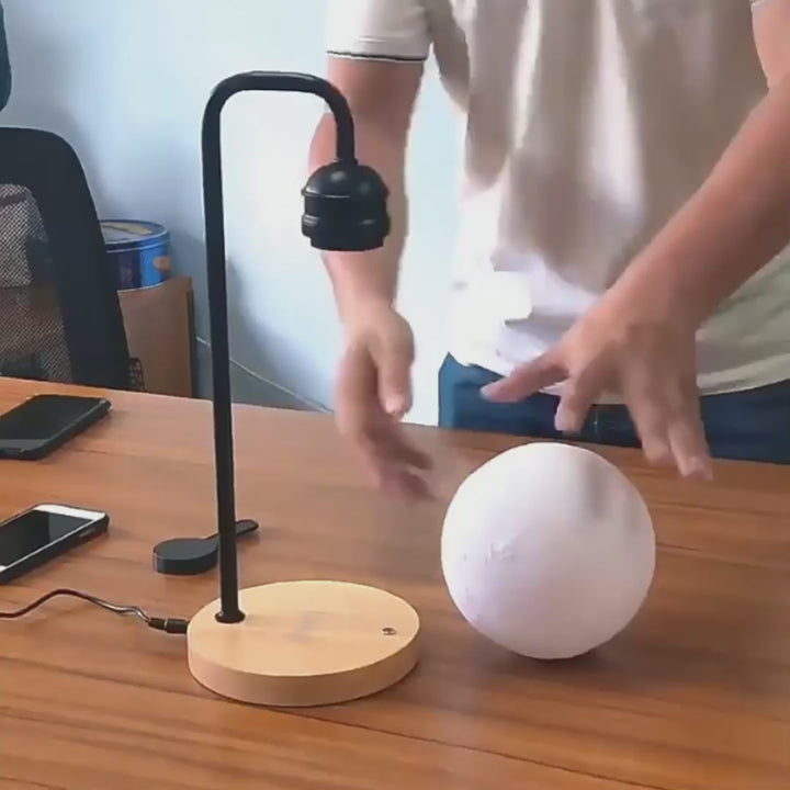 levitating-floating-magnetic-moon-lamp-wireless-charging-pad-demo